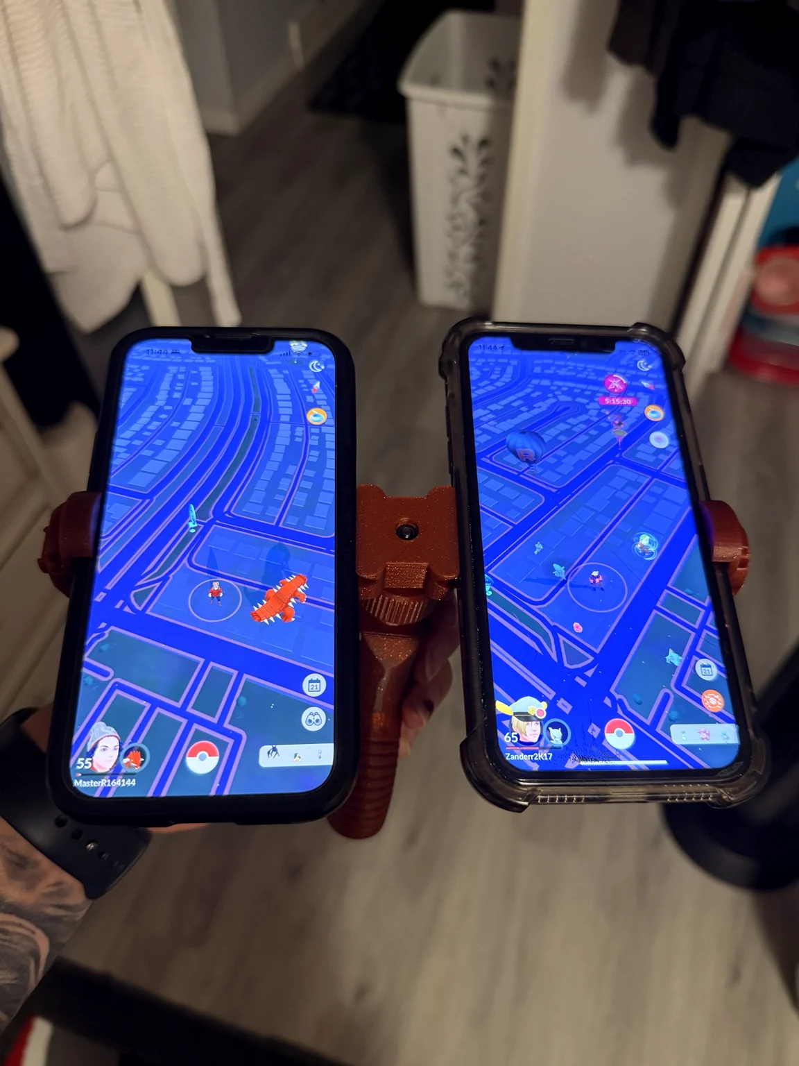 A real D3DPS dual phone holder carrying two phones while playing Pokémon GO
